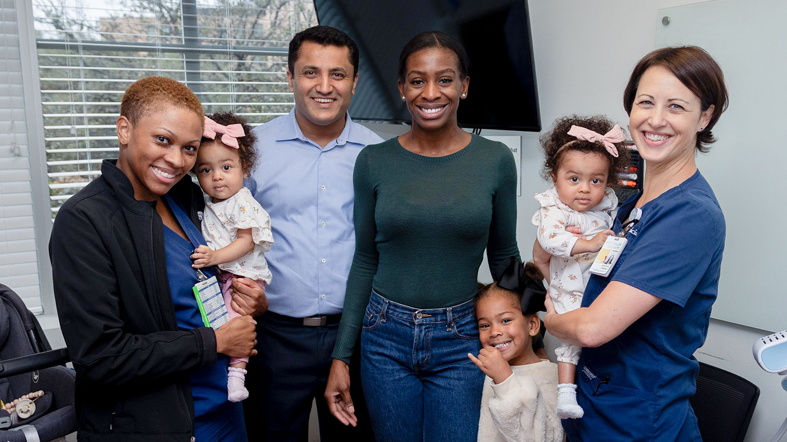 Dr. Papanna with twins, with nurses and the patients mother