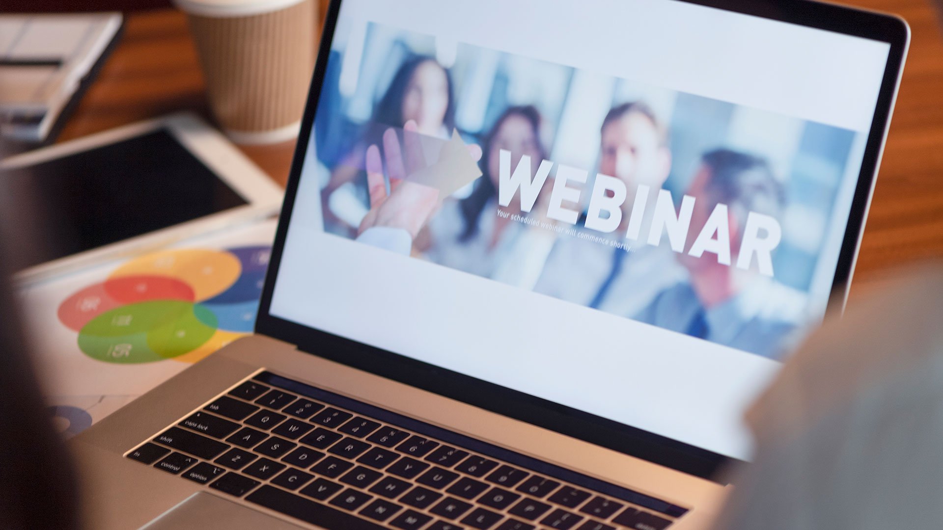 Laptop screen showing a webinar