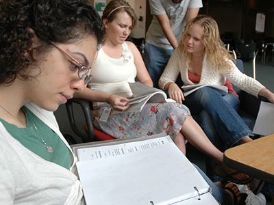 UTHealth Houston Students reading and completing course work.