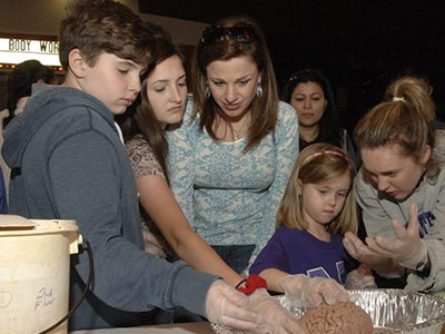 Adults and children participating at UTHealth Houston's Brain Night.