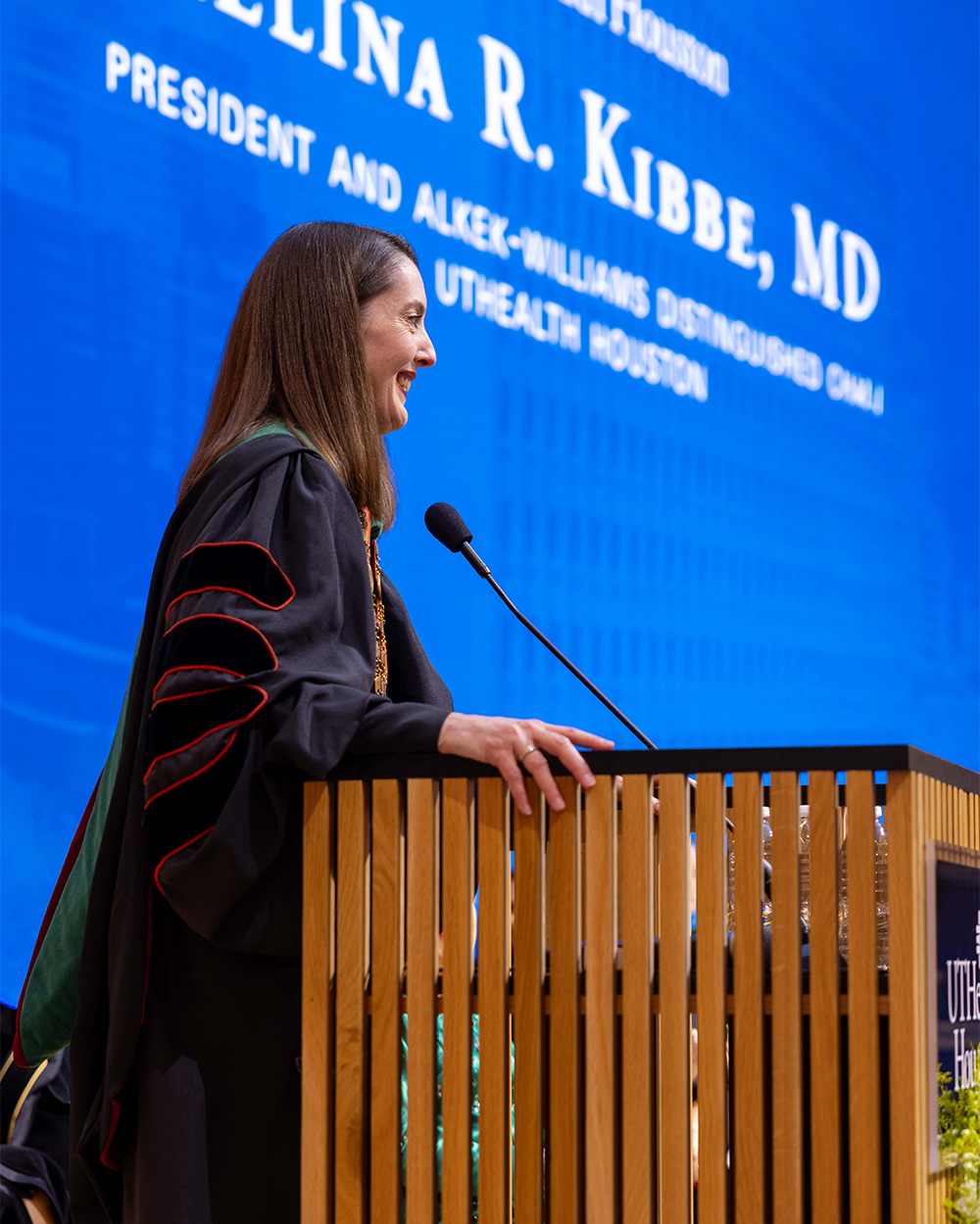 President Melina Kibbe delivers remarks from the podium during her investiture as president of UTHealth Houston.