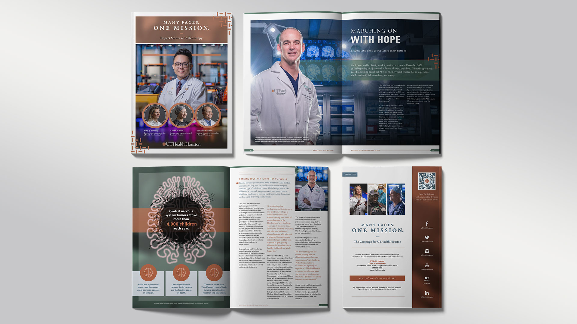 Male researcher in lab coat and safety glasses sits at a microscope, smiling while writing in a notebook, with two colleagues working behind him in a laboratory setting.
