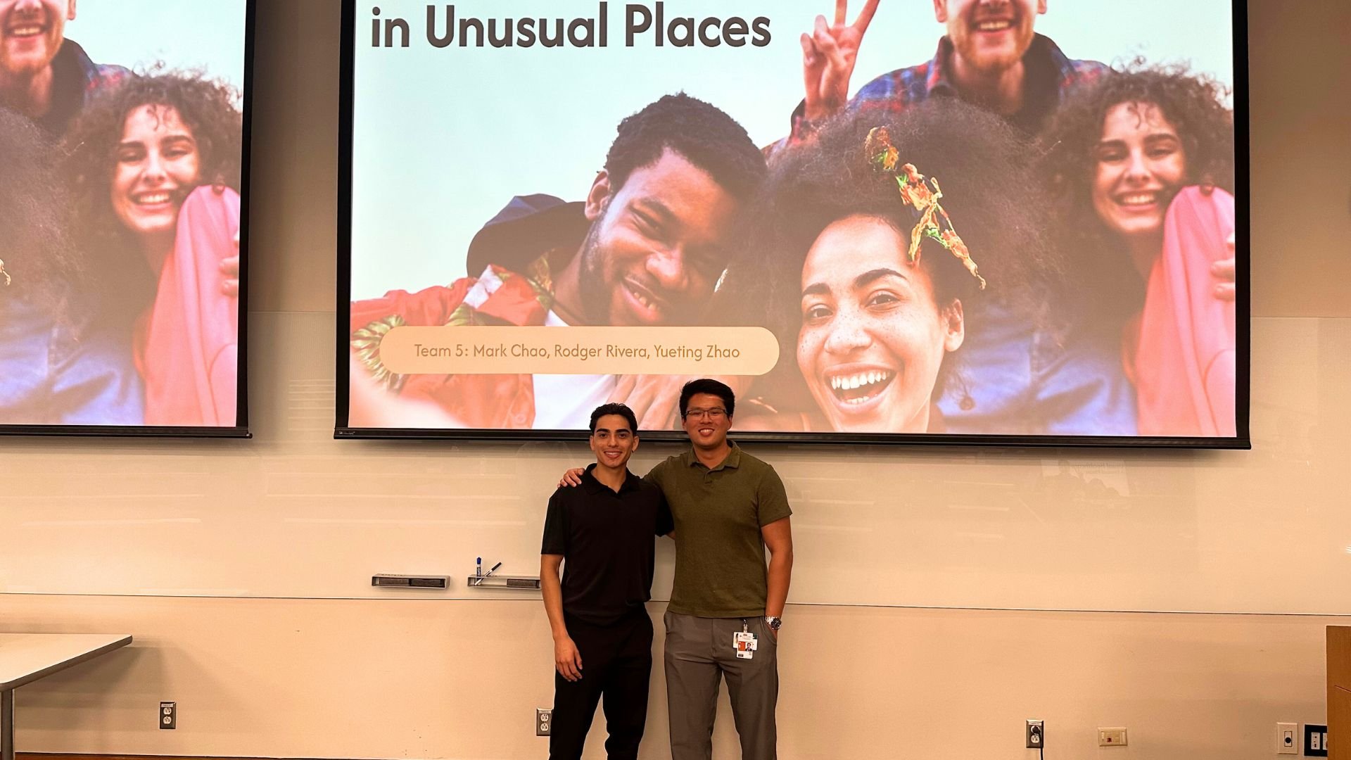 Two students standing for a picture together.